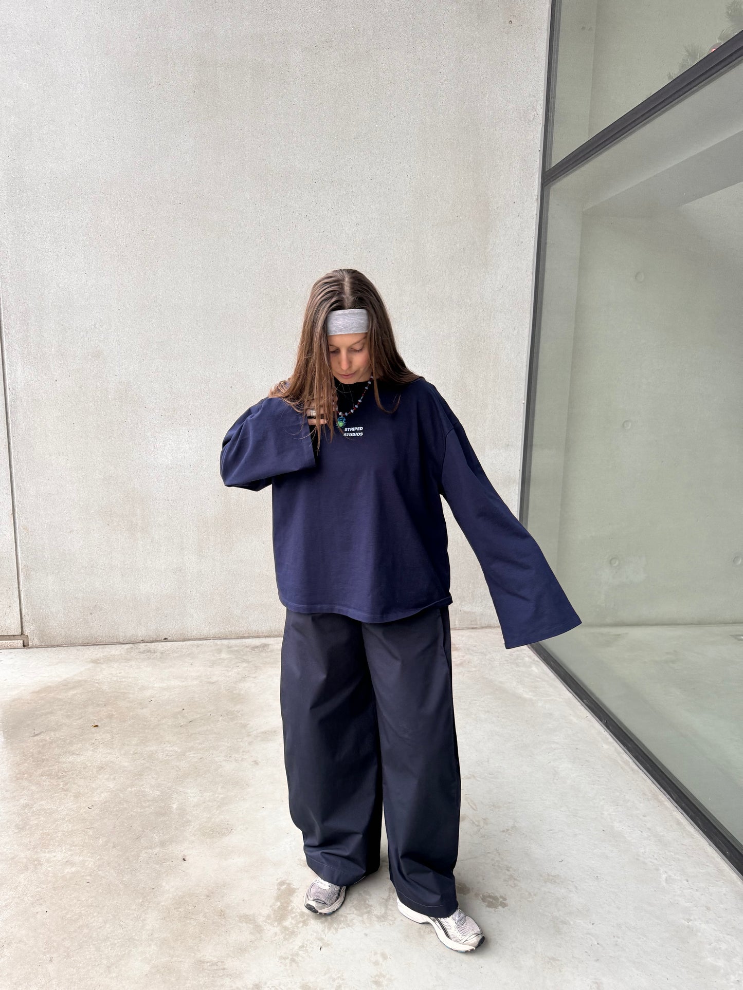 NAVY PLEATED TROUSERS