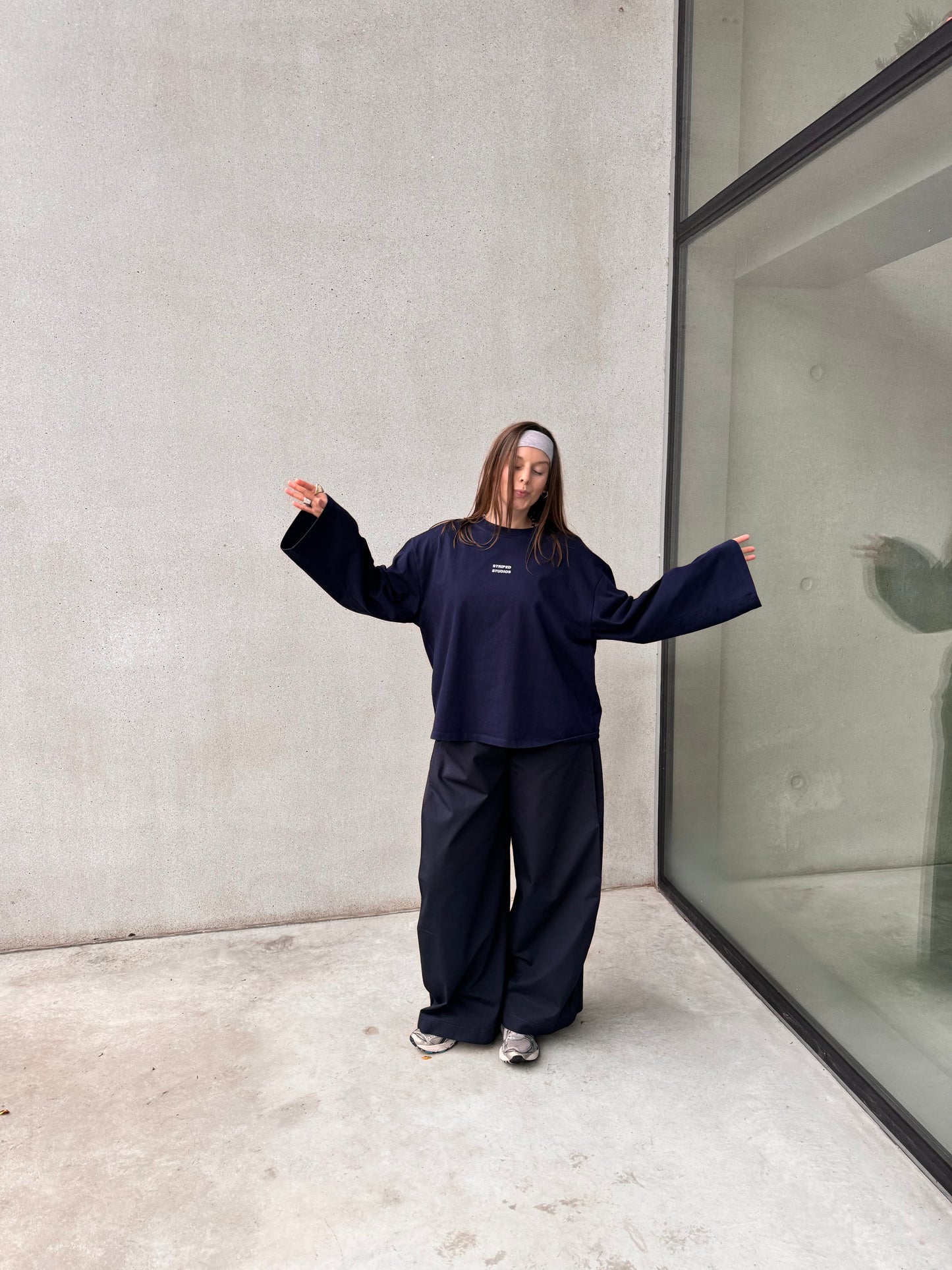 NAVY PLEATED TROUSERS