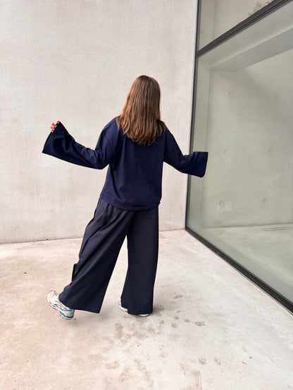 NAVY PLEATED TROUSERS